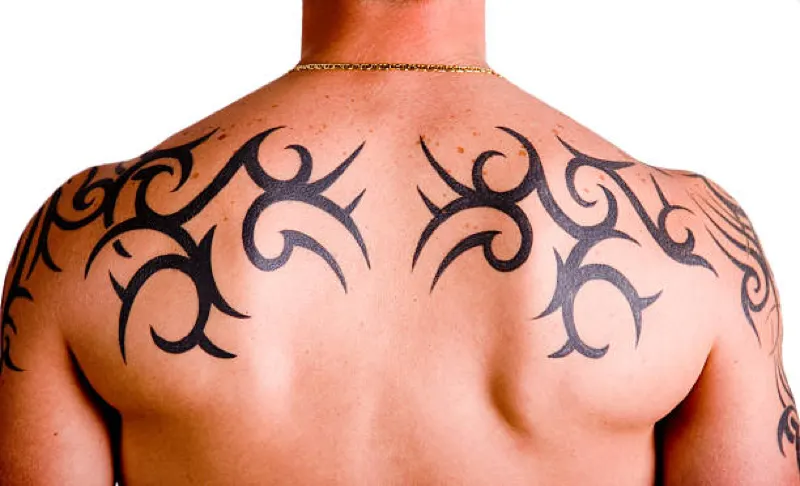 tribal tattoo on mans back