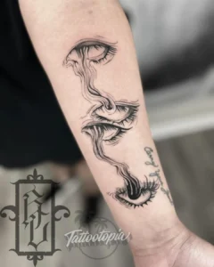 melting eyes arm tattoo roger cazares tattootopia