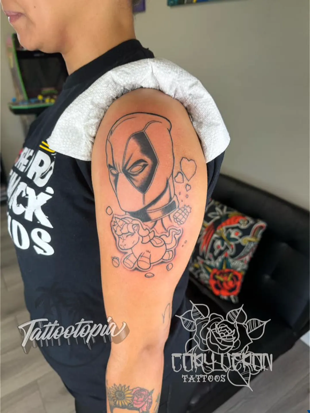 black and gray cross with cloth arm tattoo cory veron tattootopia