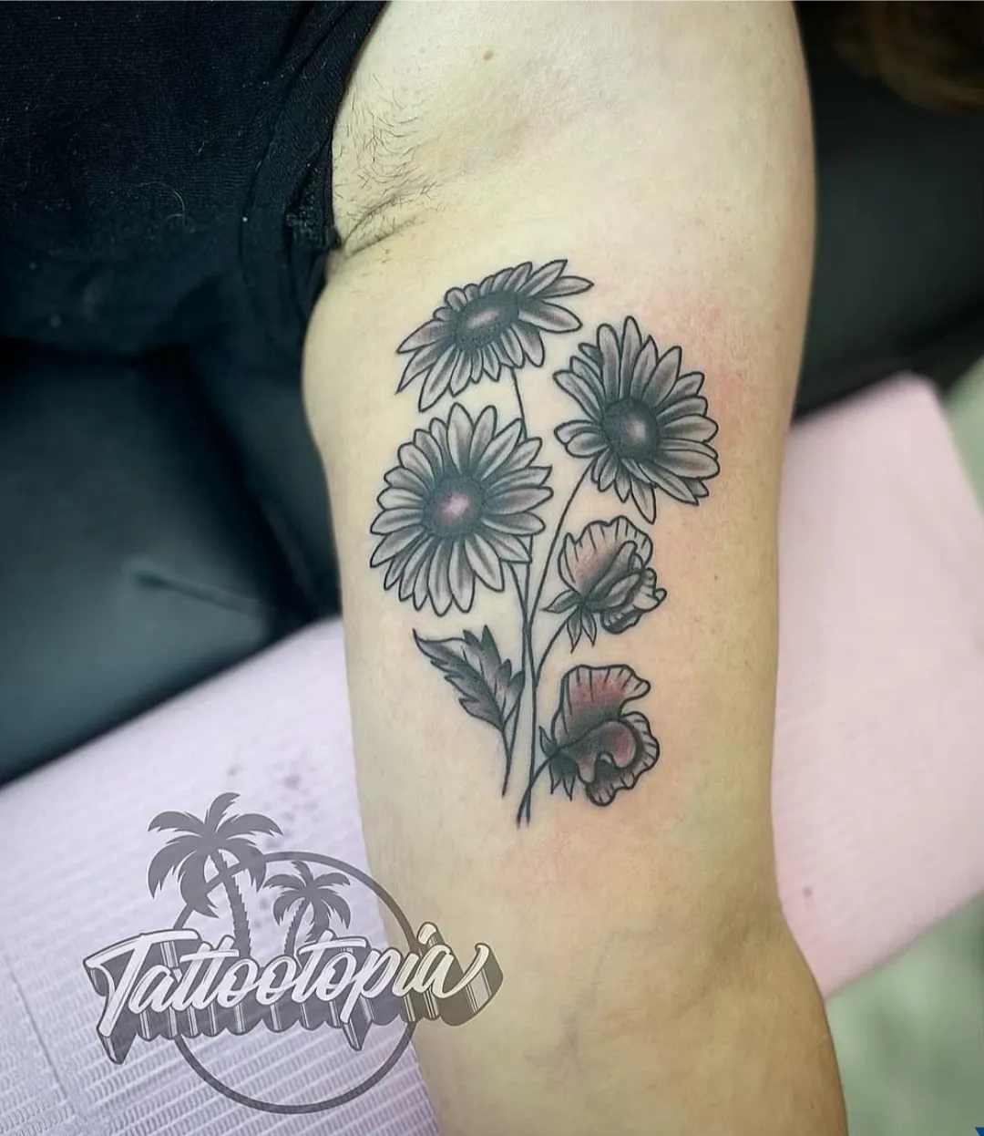 black and gray daisy flower arm tattoo cory veron tattootopia