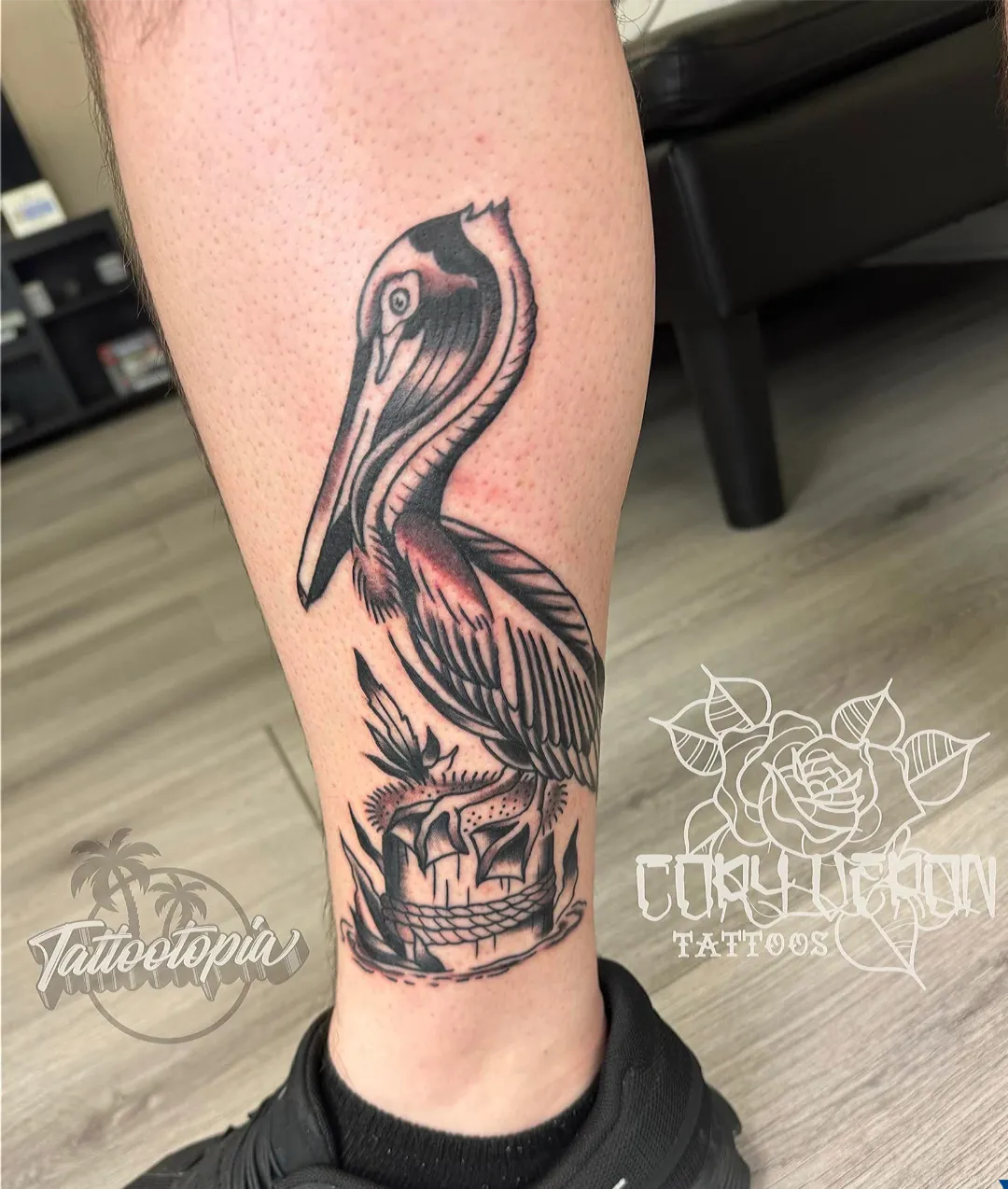 black and gray pelican on pylon leg tattoo cory veron tattootopia