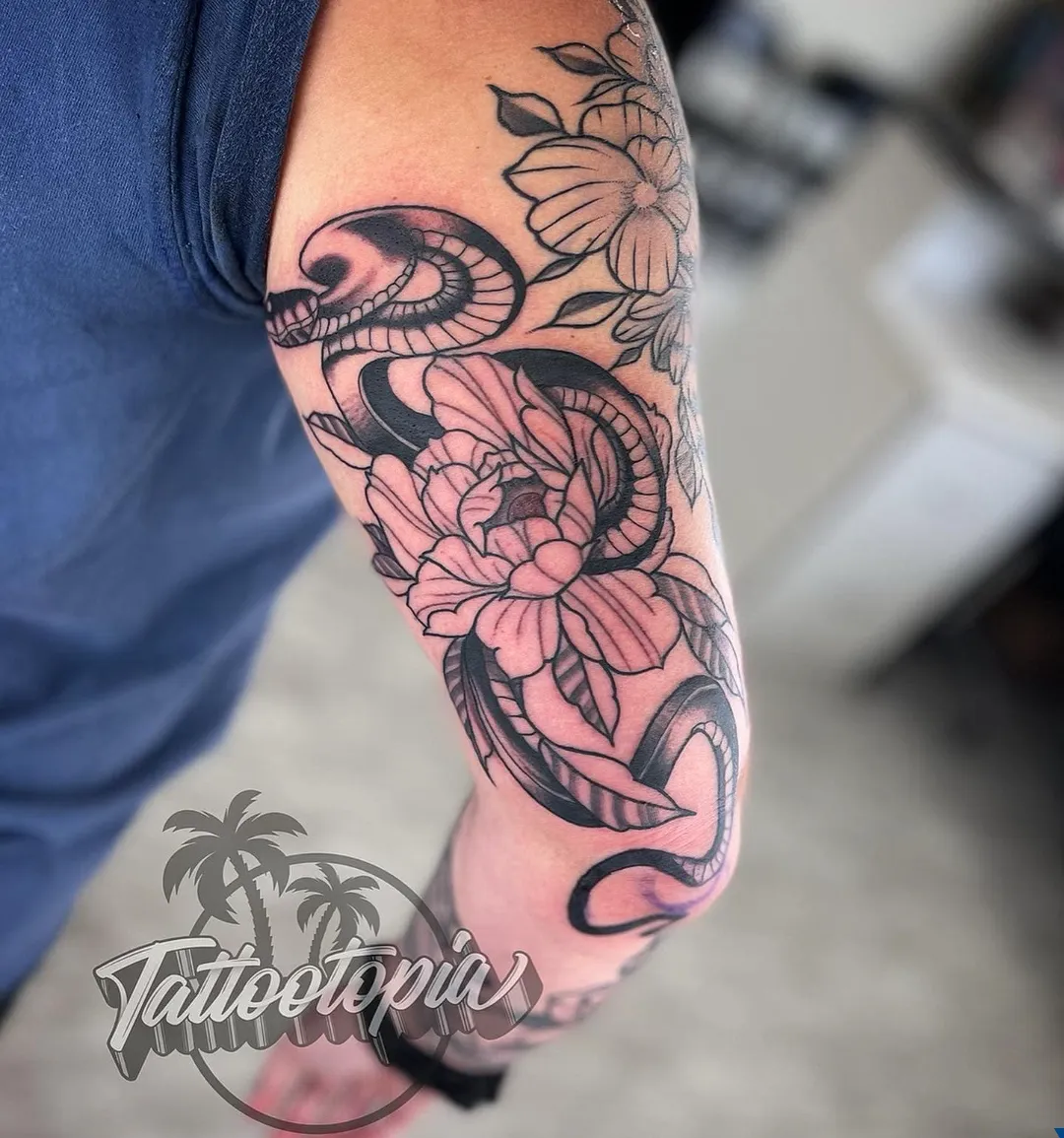 black and gray skull snake roses arm tattoo cory veron tattootopia