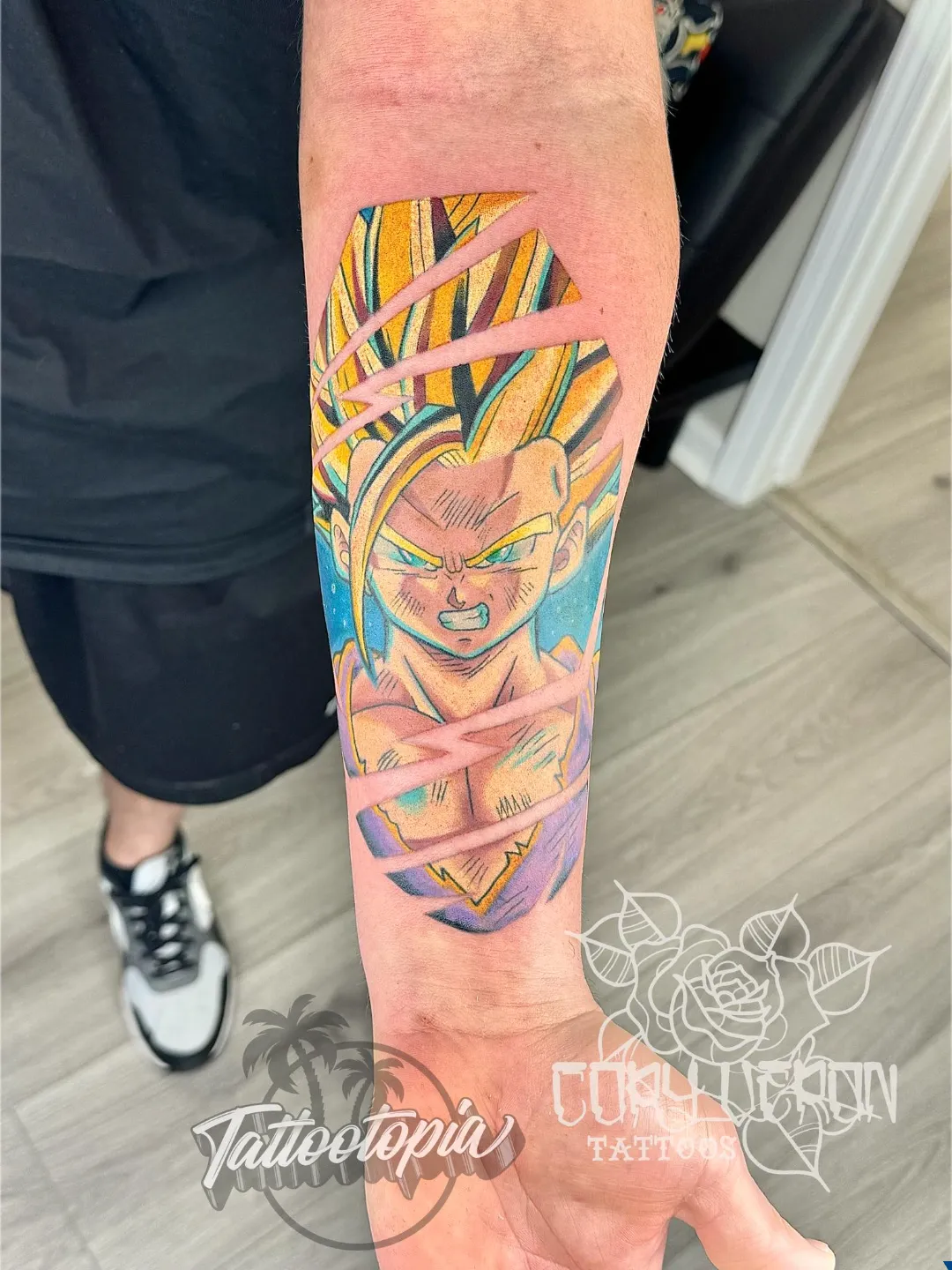 black and gray skull with rose forearm tattoo cory veron tattootopia