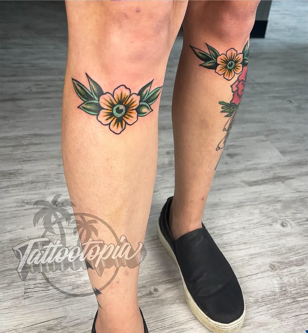 small yellow flower knee tattoo cory veron tattootopia