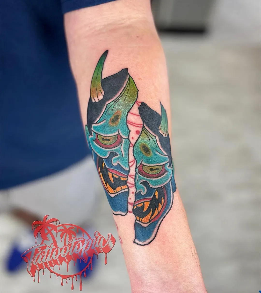 split demon mask forearm tattoo cory veron tattootopia