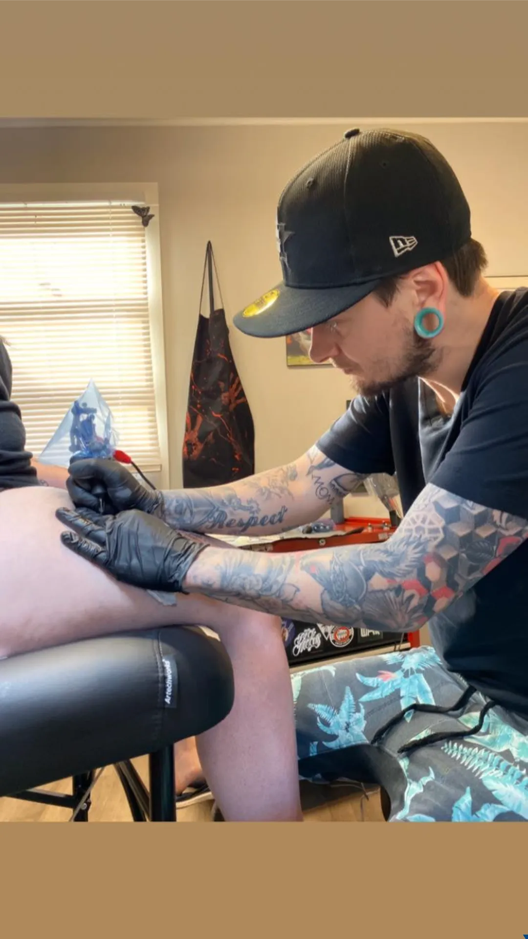 tattoo artist in studio working cory veron tattootopia