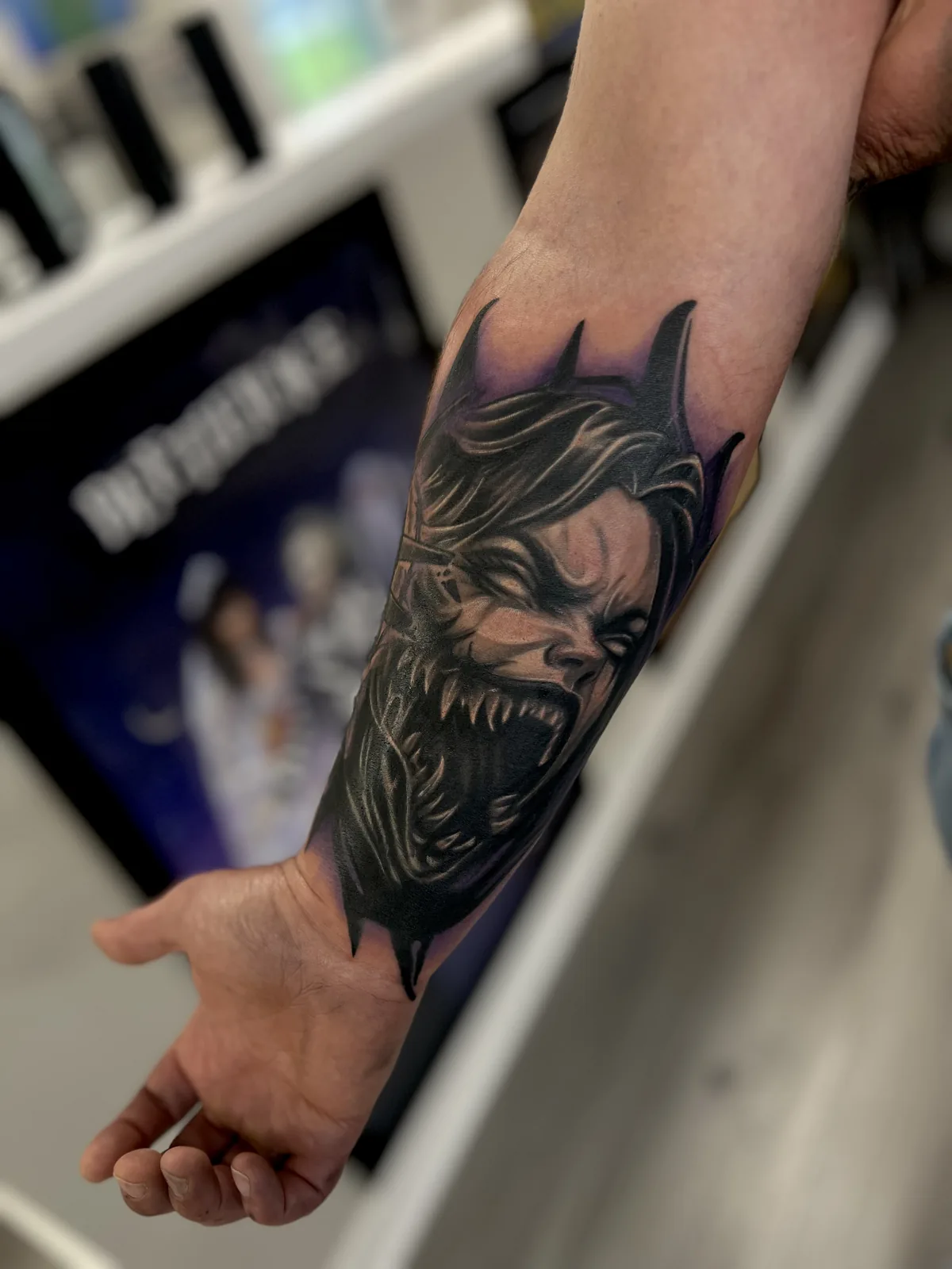 black and gray comic villain portrait forearm tattoo jeff thibodaux tattootopia
