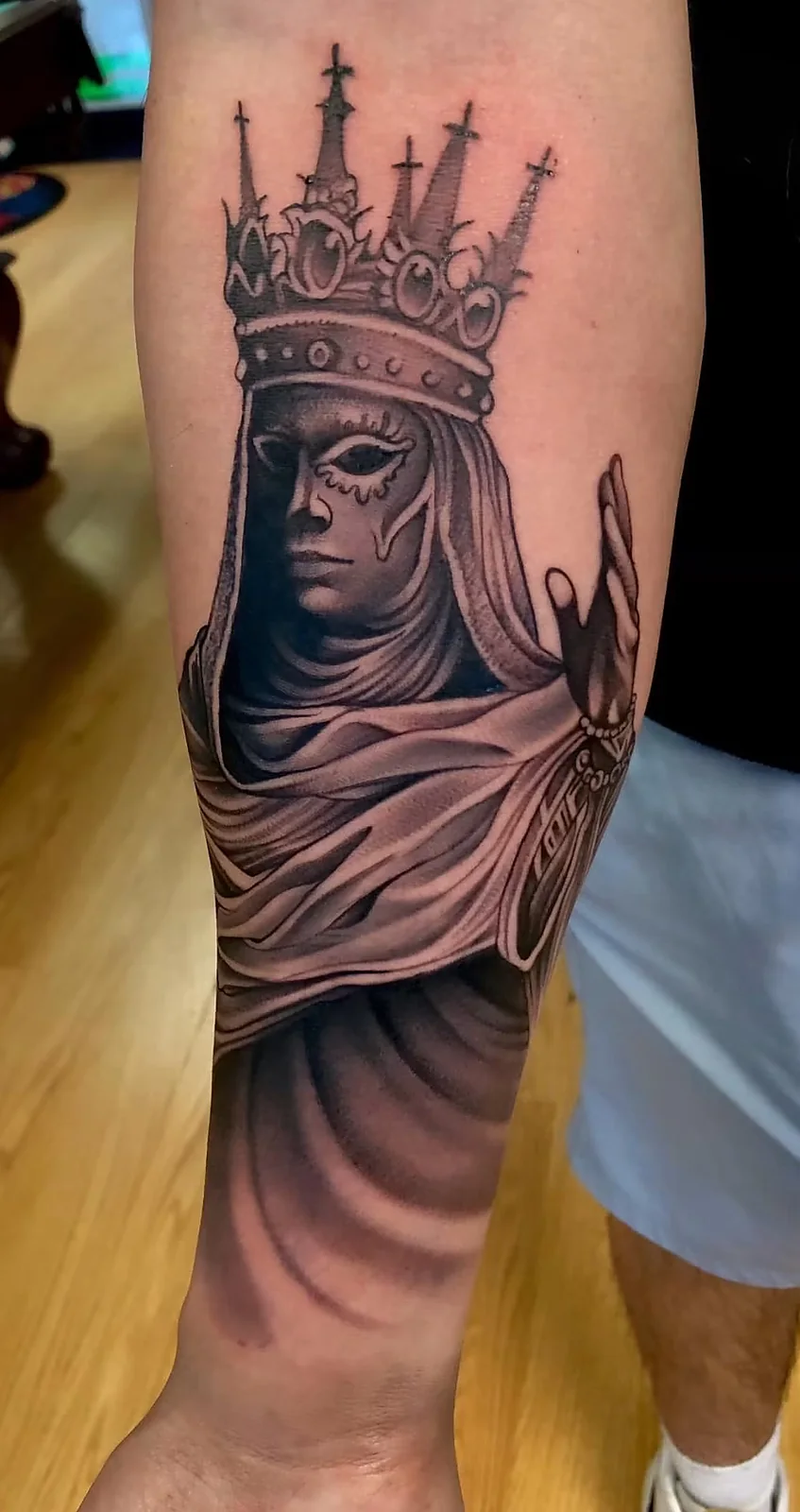 black and gray crowned madonna portrait calf tattoo halo minier tattootopia