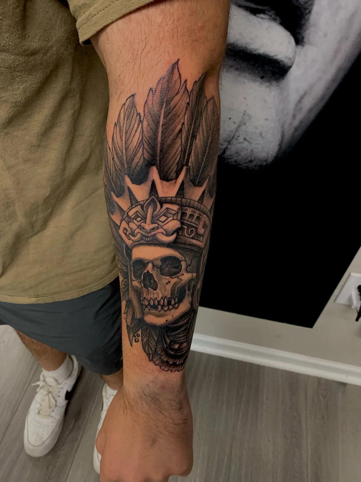 black and gray crowned skull forearm tattoo jeff thibodaux tattootopia