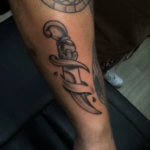 black and gray dagger forearm tattoo josh lockhart tattootopia