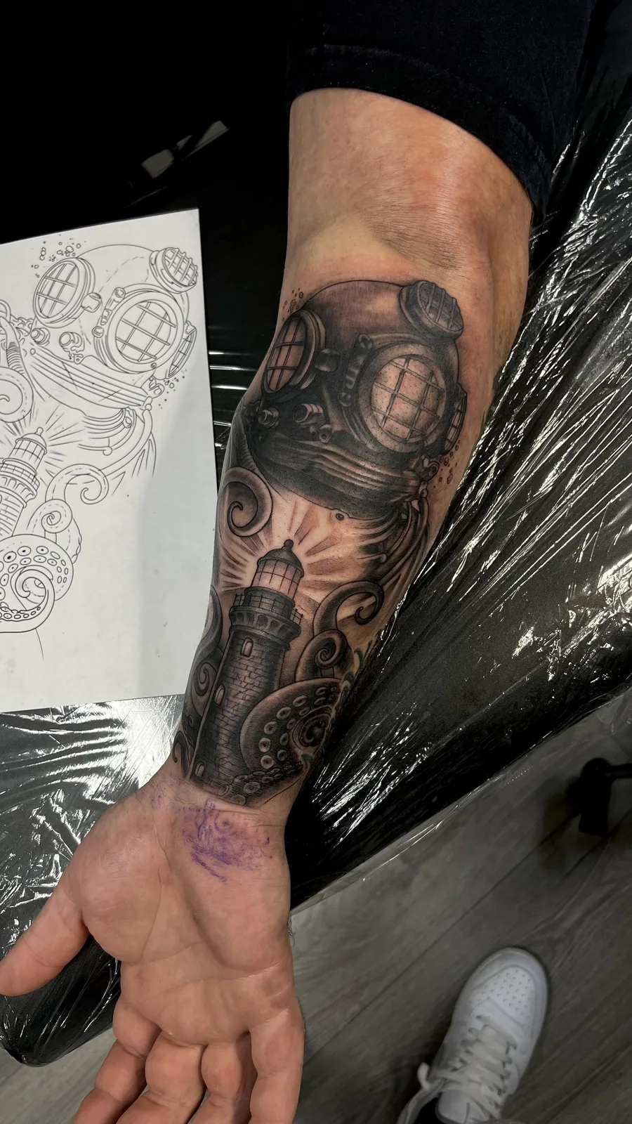 black and gray diving helmet forearm tattoo jeff thibodaux tattootopia