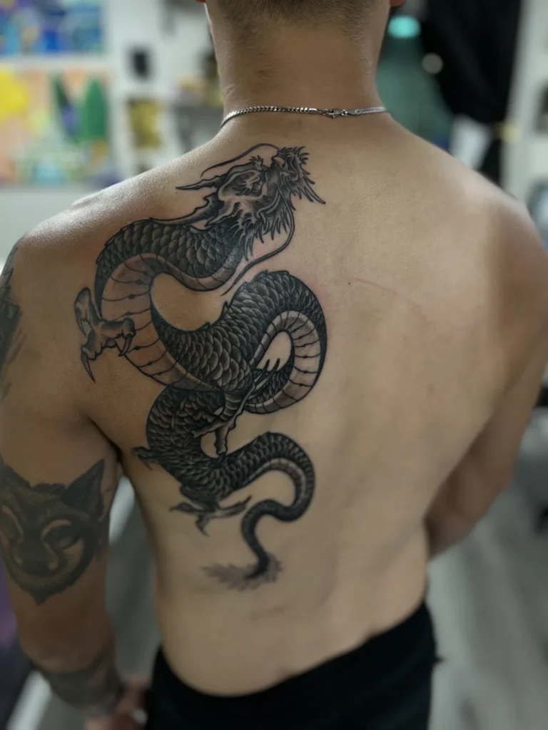 black and gray dragon back tattoo jeff thibodaux tattootopia