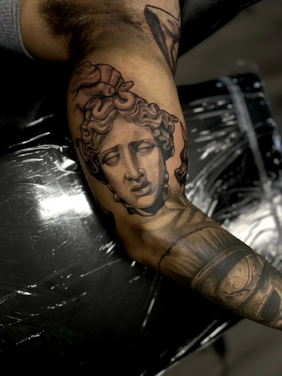 black and gray greek statue portrait arm tattoo jeff thibodaux tattootopia