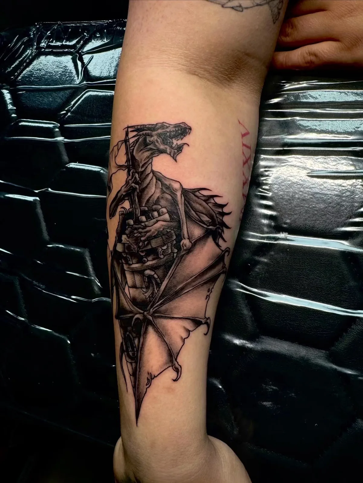 black and gray griffin upper arm tattoo josh lockhart tattootopia