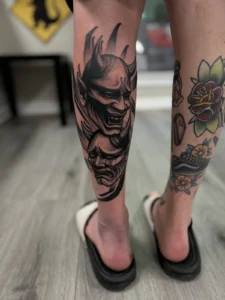 black and gray hannya mask leg tattoo jeff thibodaux tattootopia