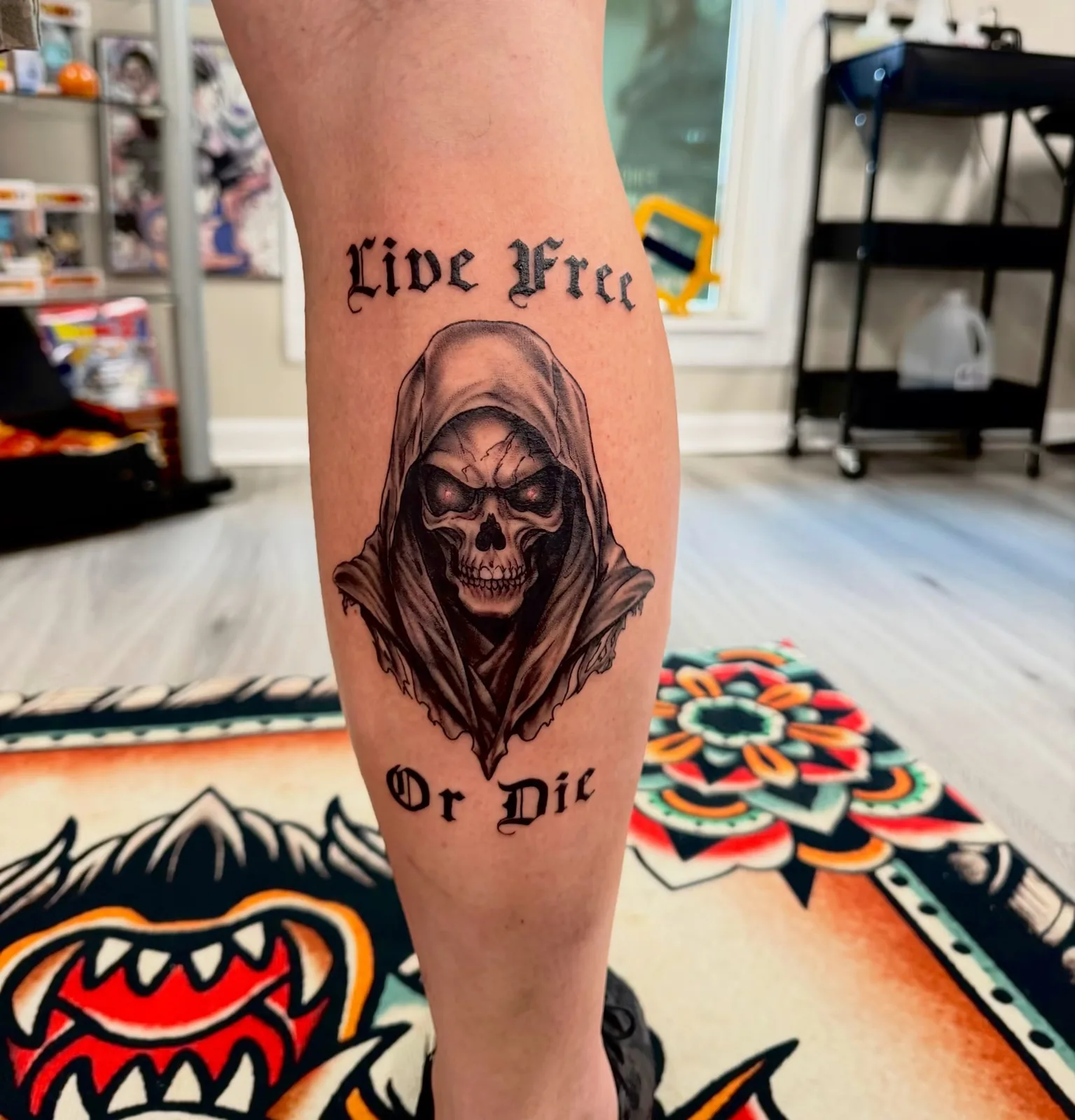 black and gray hooded reaper calf tattoo josh lockhart tattootopia