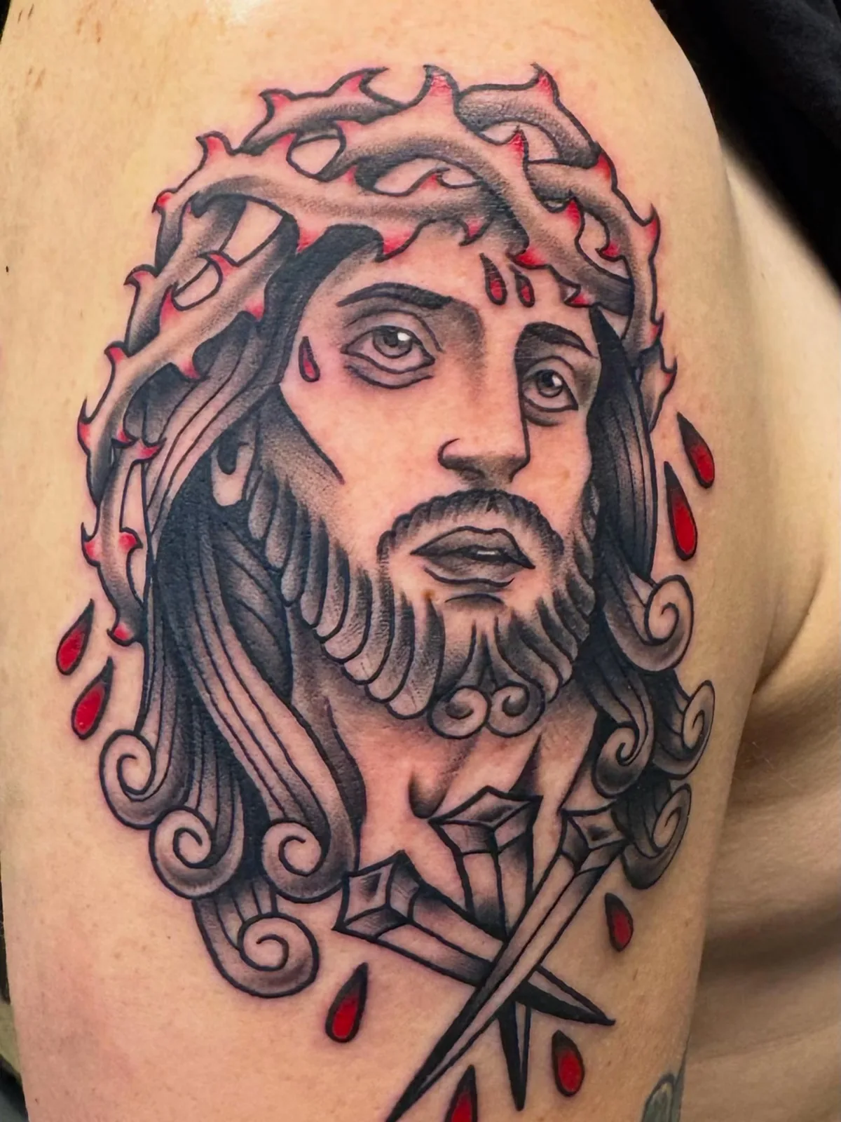 black and gray jesus crown of thorns upper arm tattoo josh lockhart tattootopia
