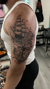 black and gray sailing ship arm tattoo jeff thibodaux tattootopia