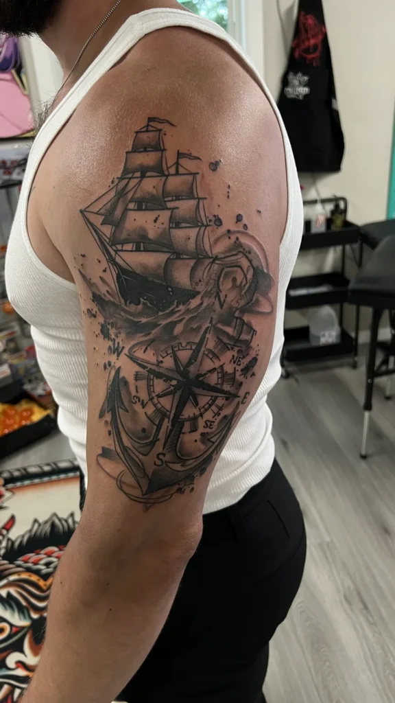 black and gray sailing ship arm tattoo jeff thibodaux tattootopia