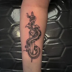 black and gray snake and dagger arm tattoo josh lockhart tattootopia
