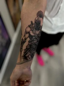 black and gray spartan warrior forearm tattoo jeff thibodaux tattootopia