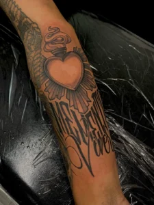 black and gray winged sacred heart arm tattoo jeff thibodaux tattootopia