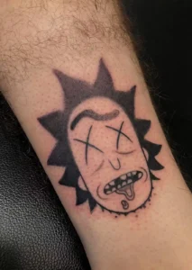 blackwork cartoon character arm tattoo halo minier tattootopia