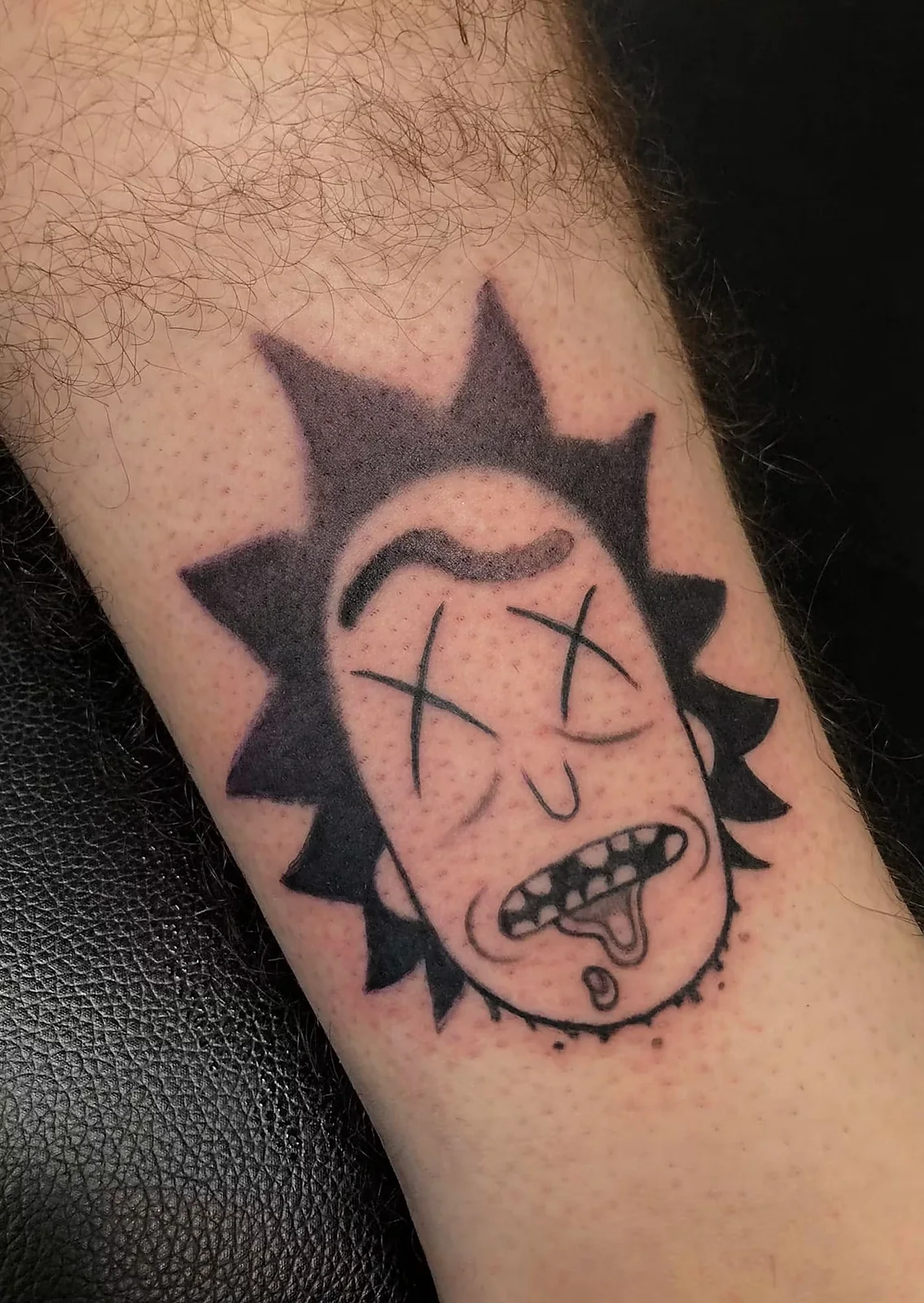 blackwork cartoon character arm tattoo halo minier tattootopia