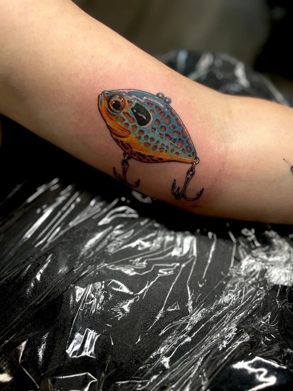 color fishing lure arm tattoo jeff thibodaux tattootopia