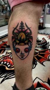 color japanese doll head calf tattoo jeff thibodaux tattootopia