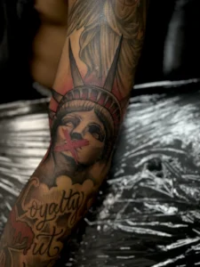 color statue of liberty portrait forearm tattoo jeff thibodaux tattootopia