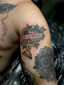 color traditional globe and camera shoulder tattoo jeff thibodaux tattootopia