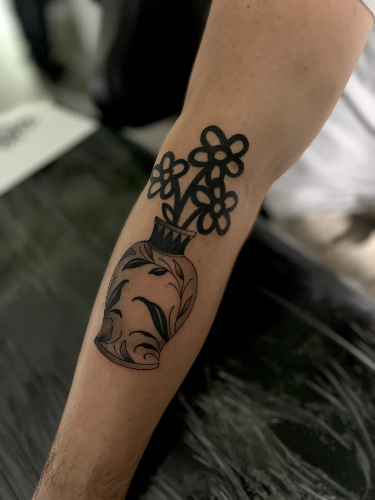 fine line flowers in a vase arm tattoo jeff thibodaux tattootopia