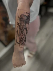 fine line statue in frame forearm tattoo jeff thibodaux tattootopia