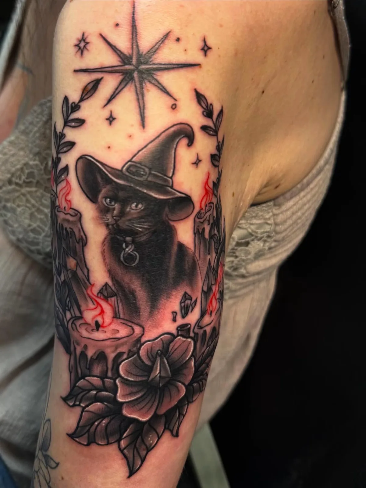 neo traditional witch hat and moon upper arm tattoo josh lockhart tattootopia