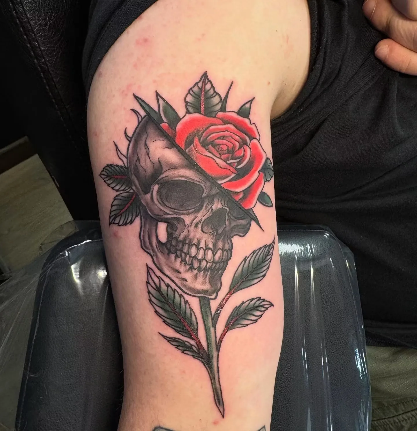 traditional skull and red rose upper arm tattoo josh lockhart tattootopia